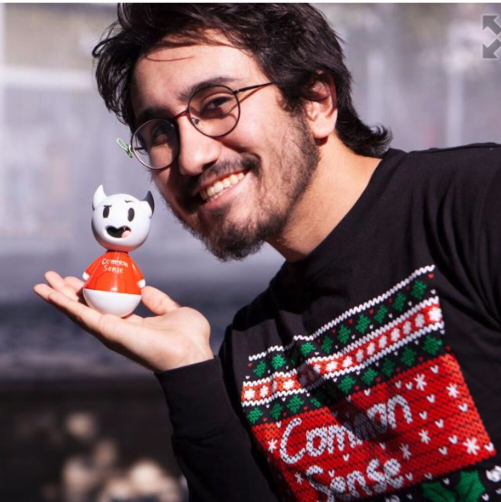Creator holding his collectible figure